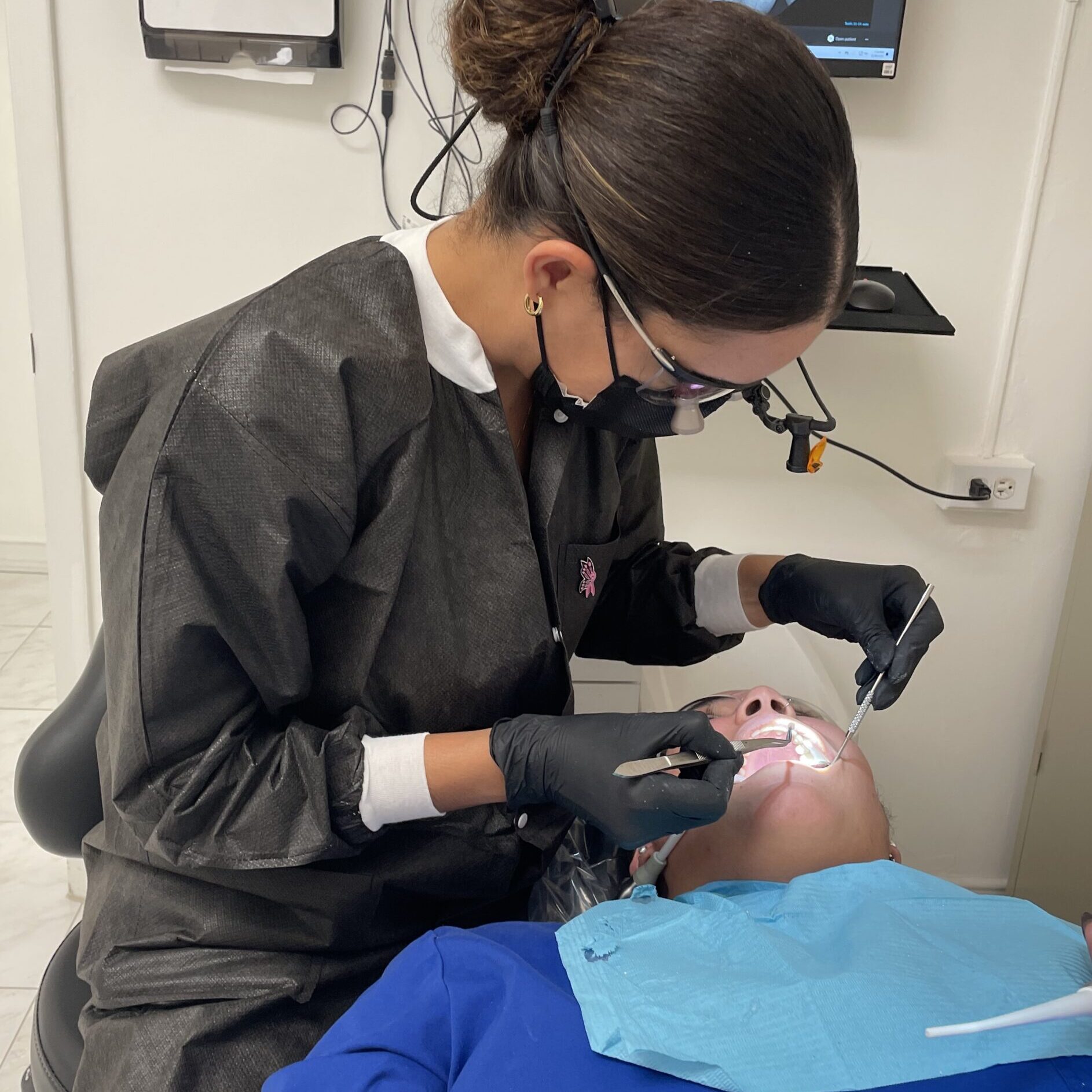 Dr. Quintana working with a patient's teeth - Q Smiles Dentistry - Implant & Cosmetic Dentistry in North Miami Beach