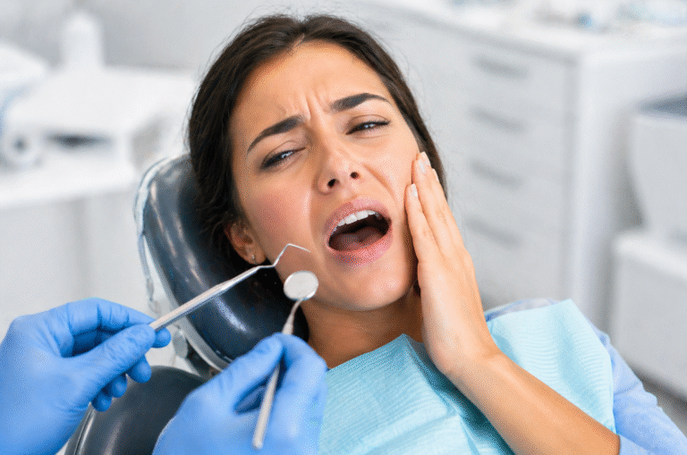 Patient in a dental chair receiving immediate care for a dental emergency.